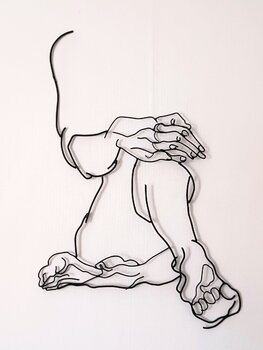 scultura in acciaio di uomo in relax luciano torre