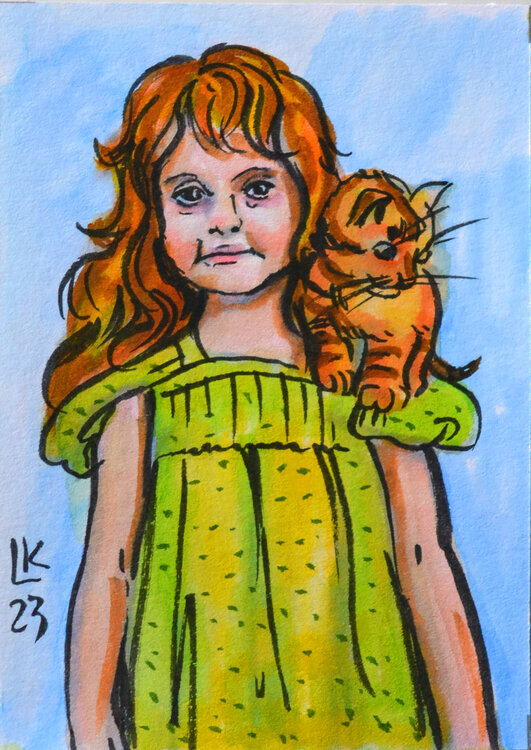 Redhead girl with orange cat Lada Kholosho